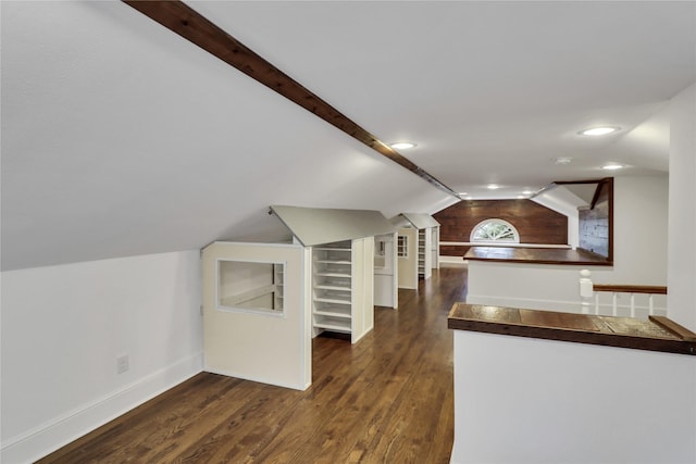 bonus room featuring vaulted ceiling with beams, baseboards, dark wood-style flooring, and recessed lighting