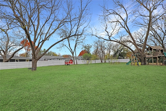 1102 Howell St, Mckinney, TX 75069 - fenced backyard with a playground