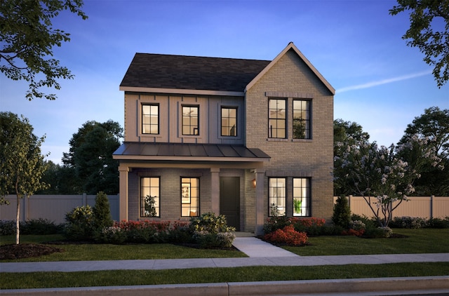 view of front facade featuring a front yard