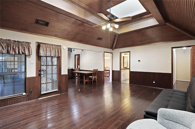 living room with ceiling fan, dark hardwood / wood-style flooring, wooden ceiling, and lofted ceiling