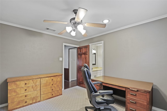 carpeted office featuring crown molding and ceiling fan