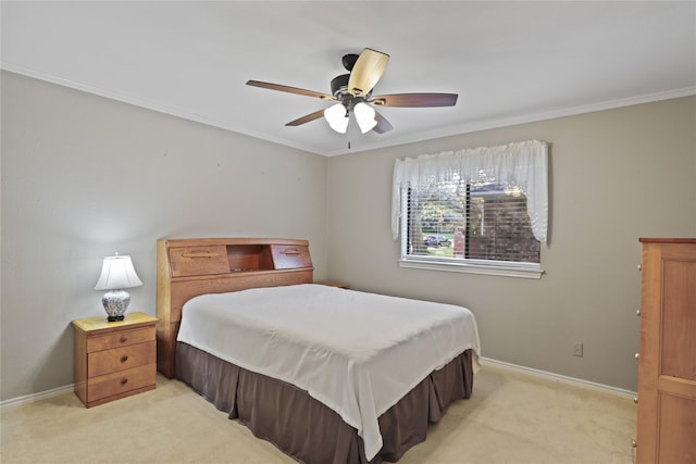 bedroom with light colored carpet, ceiling fan, and ornamental molding