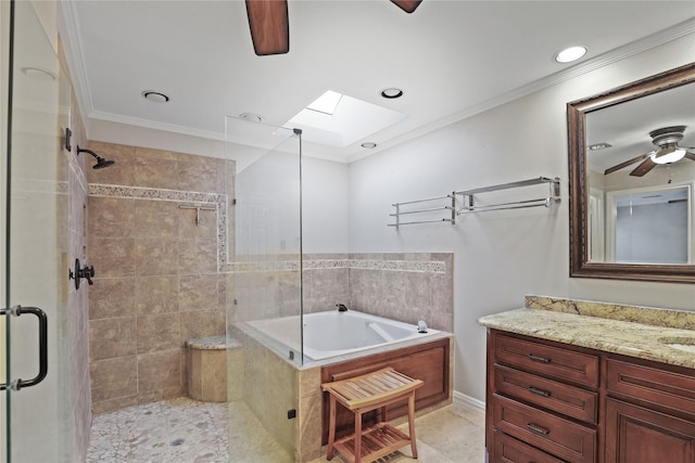 bathroom with vanity, crown molding, a skylight, ceiling fan, and independent shower and bath