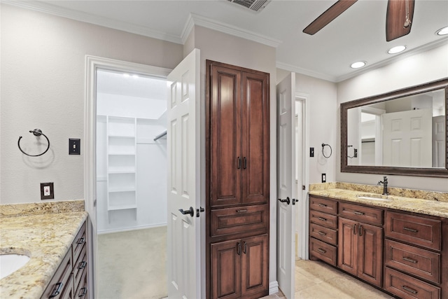 bathroom with vanity and ornamental molding