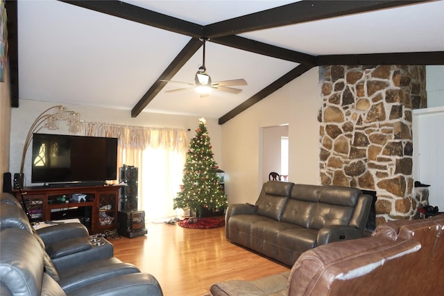 living room featuring lofted ceiling with beams, ceiling fan, and wood-type flooring