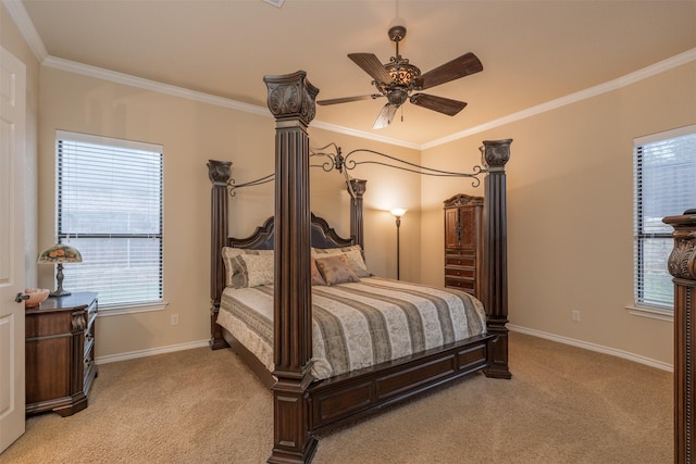 bedroom with light colored carpet, crown molding, baseboards, and ceiling fan