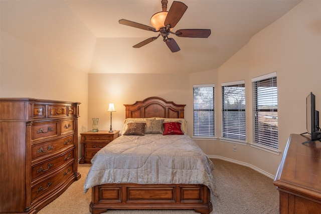bedroom featuring light colored carpet, lofted ceiling, a ceiling fan, and baseboards