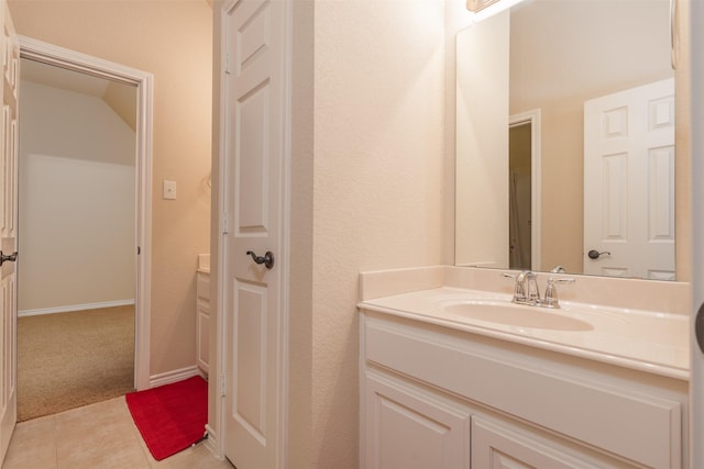 bathroom with vanity and tile patterned flooring