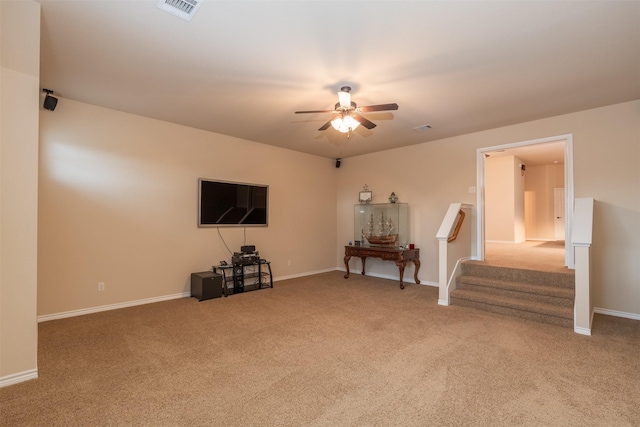 unfurnished living room with ceiling fan and carpet floors