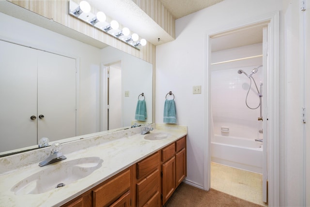 bathroom featuring shower / bathing tub combination and vanity