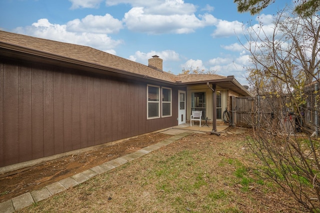 back of house with a patio