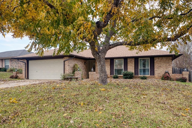 ranch-style house with a front lawn and a garage