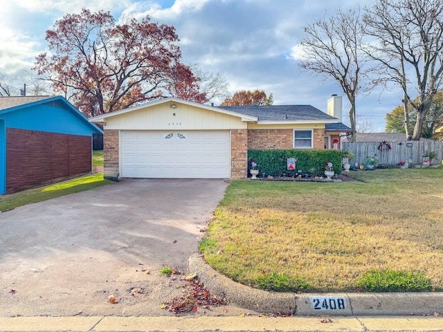 ranch-style house featuring a garage and a front yard