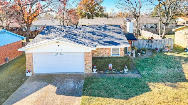 view of front facade with a garage and a front yard