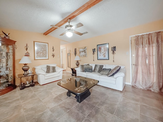 living room featuring tile patterned floors, vaulted ceiling with beams, ceiling fan, and a textured ceiling