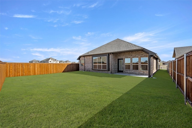 back of house featuring a lawn