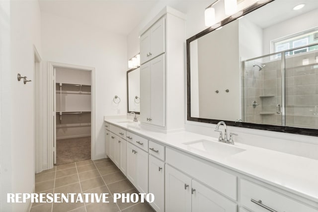 bathroom featuring vanity, tile patterned floors, and a shower with shower door