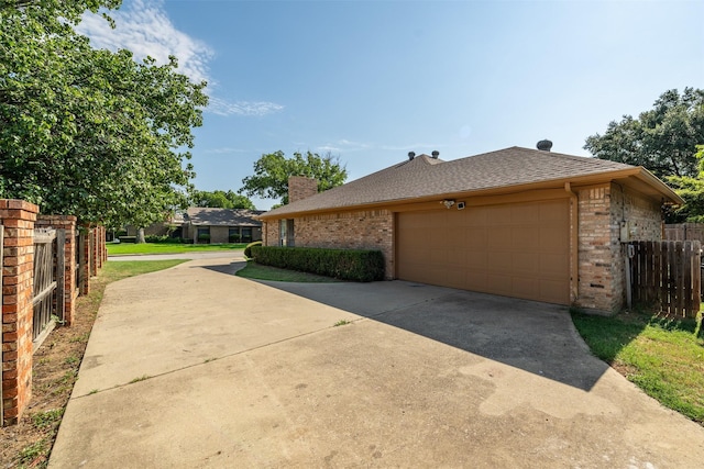 view of side of property featuring a garage