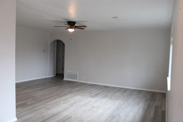 spare room featuring ceiling fan and light hardwood / wood-style floors