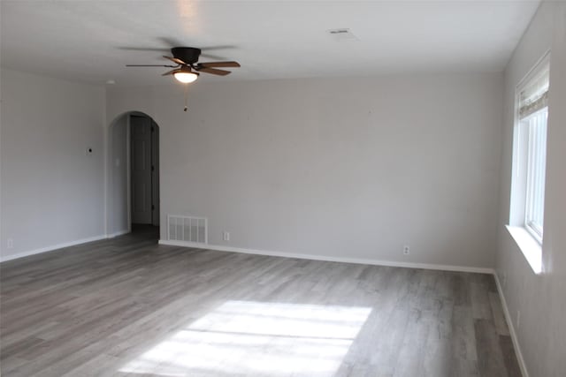 unfurnished room with hardwood / wood-style floors and ceiling fan