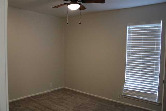 unfurnished room with ceiling fan and carpet flooring