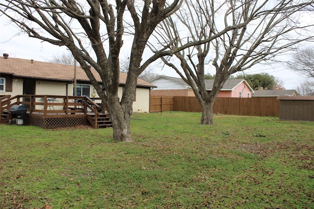 view of yard with a wooden deck