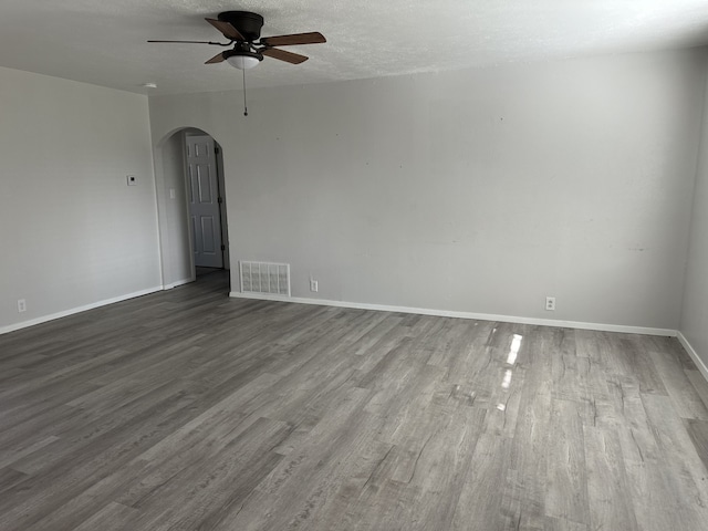 spare room featuring ceiling fan, a textured ceiling, and hardwood / wood-style flooring