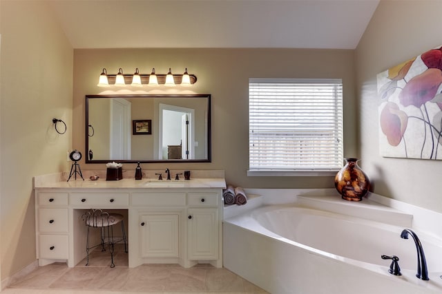 full bathroom featuring lofted ceiling, tile patterned flooring, a garden tub, and vanity