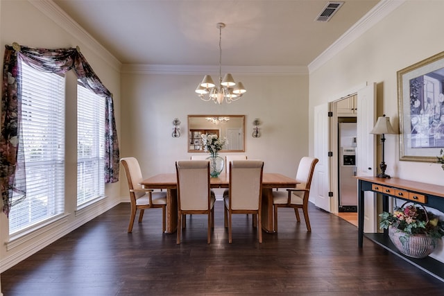 dining room featuring dark wood-style flooring, visible vents, crown molding, and an inviting chandelier