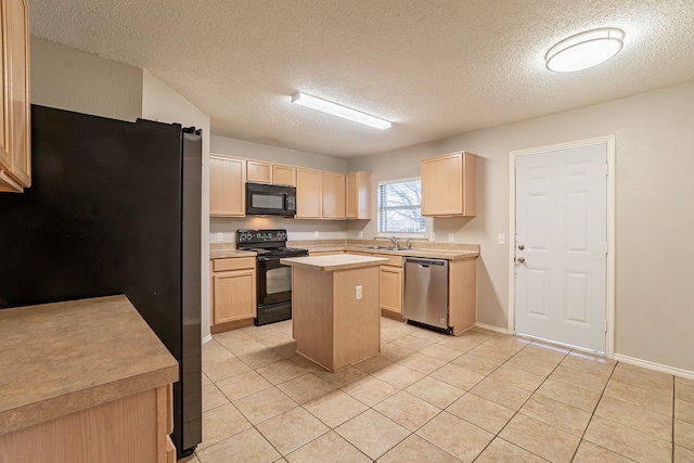 kitchen featuring light brown cabinets, light tile patterned floors, a kitchen island, a barn door, and black appliances