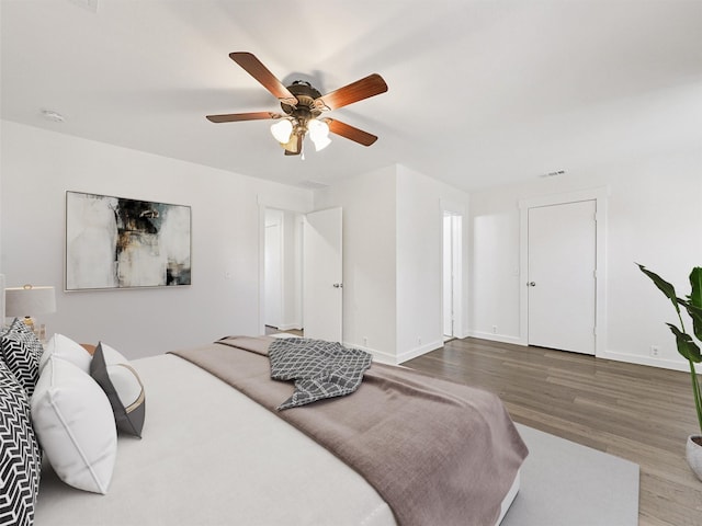 bedroom featuring hardwood / wood-style flooring and ceiling fan