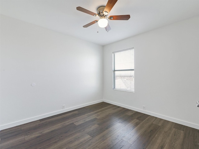 empty room featuring ceiling fan and dark hardwood / wood-style floors