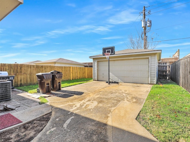 garage featuring cooling unit and a lawn