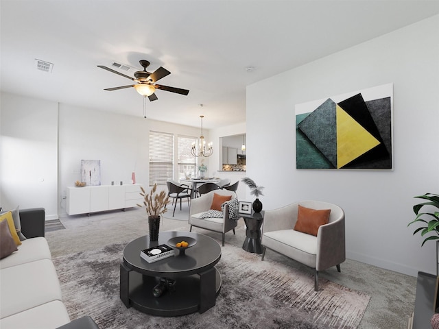 carpeted living room with ceiling fan with notable chandelier