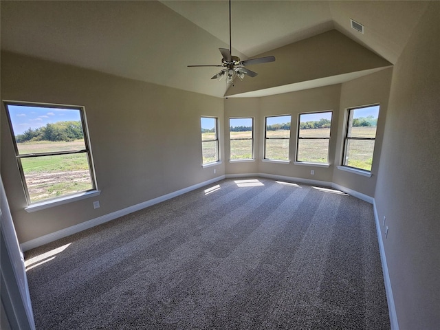 spare room featuring carpet flooring, ceiling fan, and lofted ceiling