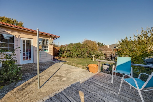 wooden terrace with a lawn