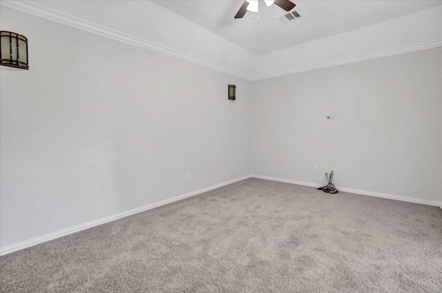 empty room with carpet flooring, ceiling fan, and crown molding