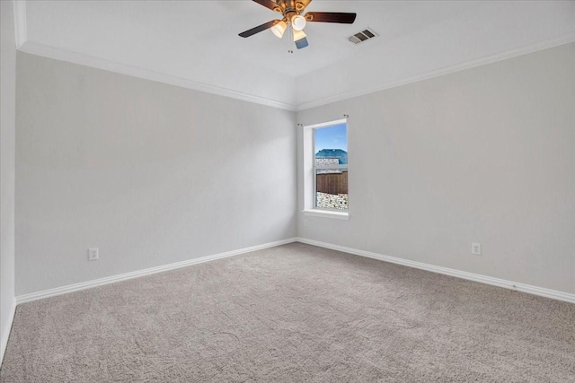 empty room featuring carpet flooring, ceiling fan, and ornamental molding