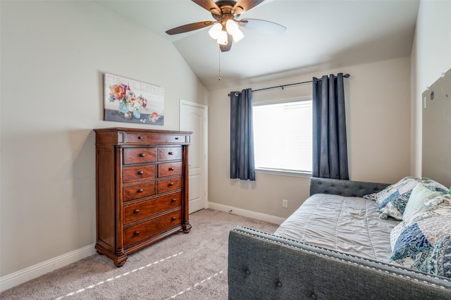 bedroom with lofted ceiling, light carpet, and ceiling fan