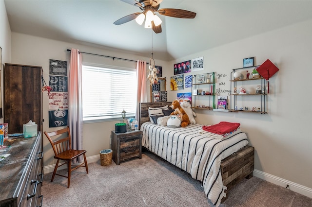 carpeted bedroom with vaulted ceiling and ceiling fan