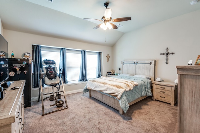 carpeted bedroom with vaulted ceiling and ceiling fan