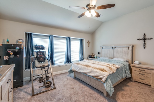 carpeted bedroom with vaulted ceiling and ceiling fan