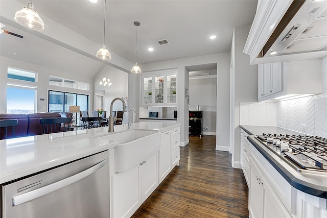 kitchen with extractor fan, stainless steel appliances, backsplash, white cabinets, and sink