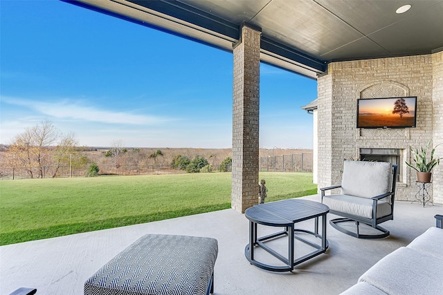 view of patio / terrace featuring an outdoor brick fireplace