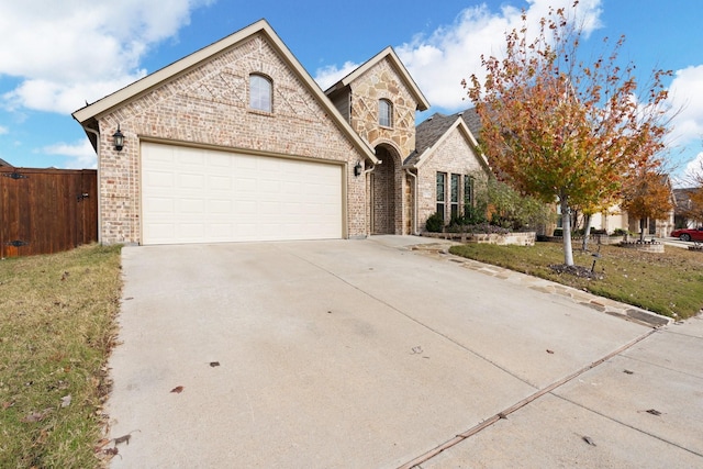 view of front facade featuring a garage and a front yard