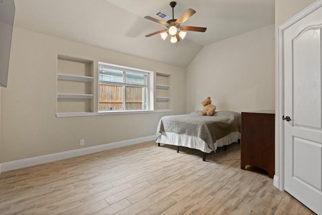 bedroom with lofted ceiling, light hardwood / wood-style flooring, and ceiling fan