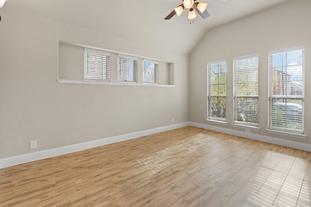 unfurnished room featuring ceiling fan, vaulted ceiling, and light hardwood / wood-style flooring