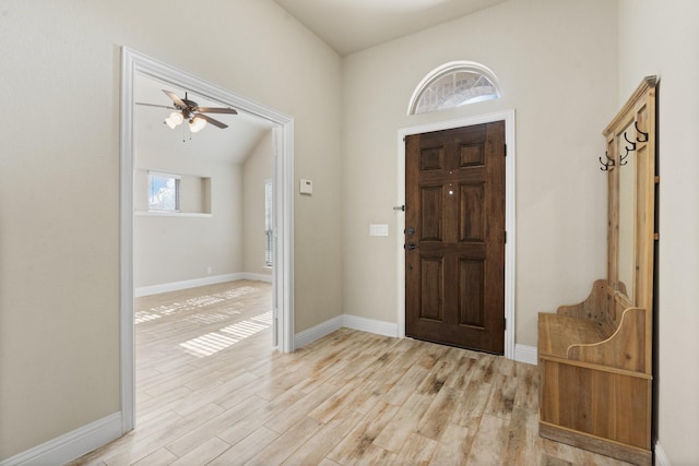 foyer entrance featuring plenty of natural light, light hardwood / wood-style floors, and ceiling fan