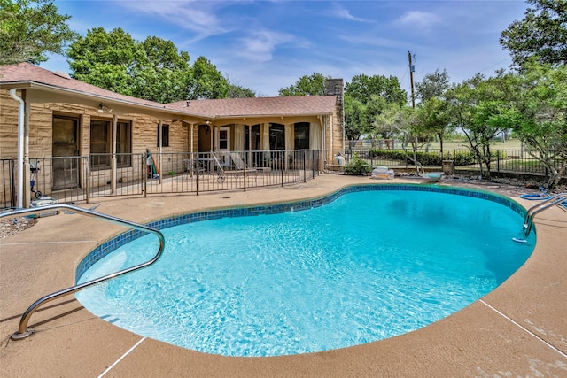 view of swimming pool with a patio