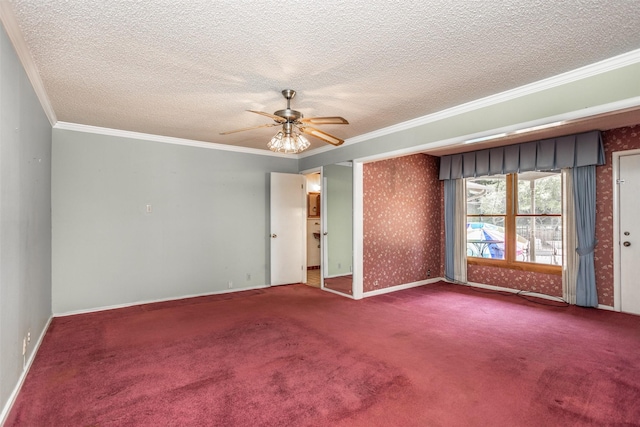 empty room featuring ceiling fan, carpet floors, a textured ceiling, and ornamental molding